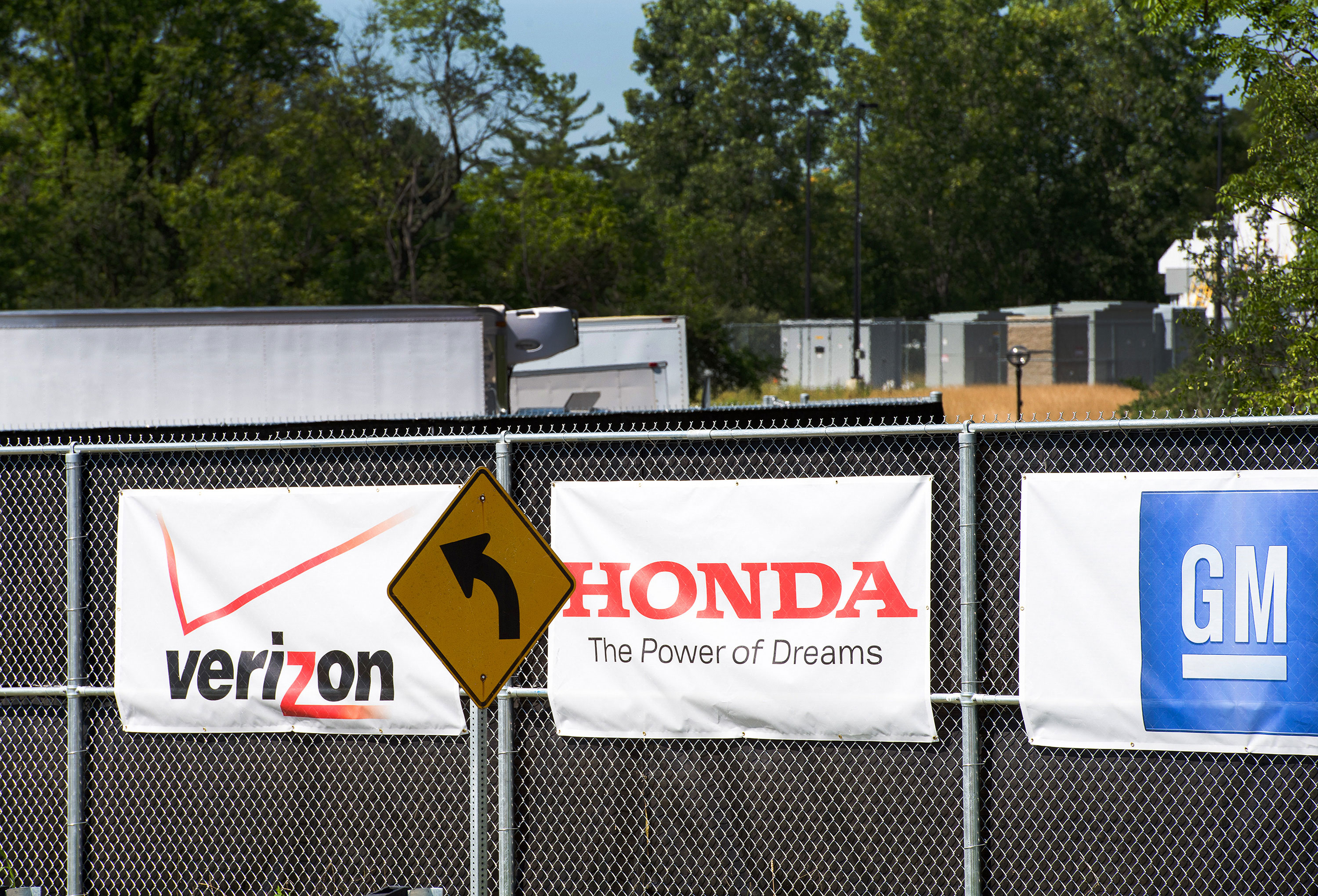 verizon honda GM logos on banners at M city test facility