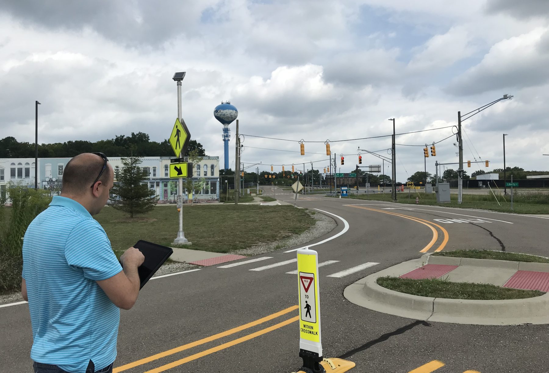 Tyler Worman, Mcity Data Architect, uses the new API to activate crosswalk lights at the Mcity Test Facility.