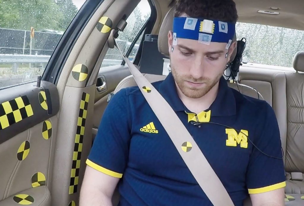male subject in car measuring motion sickness
