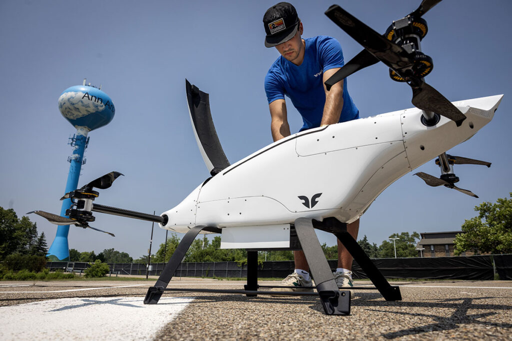Man working on drone. Mcity is expanding its ground mobility work to include air mobility with the launch of M-Air.